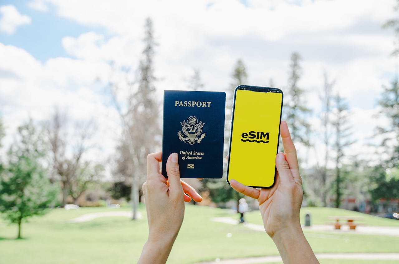 creative Holding Passport and Smartphone with eSim Application